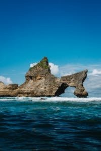 A Rock Arch at the Atuh Beach on Nusa Penida, Bali, Indonesia