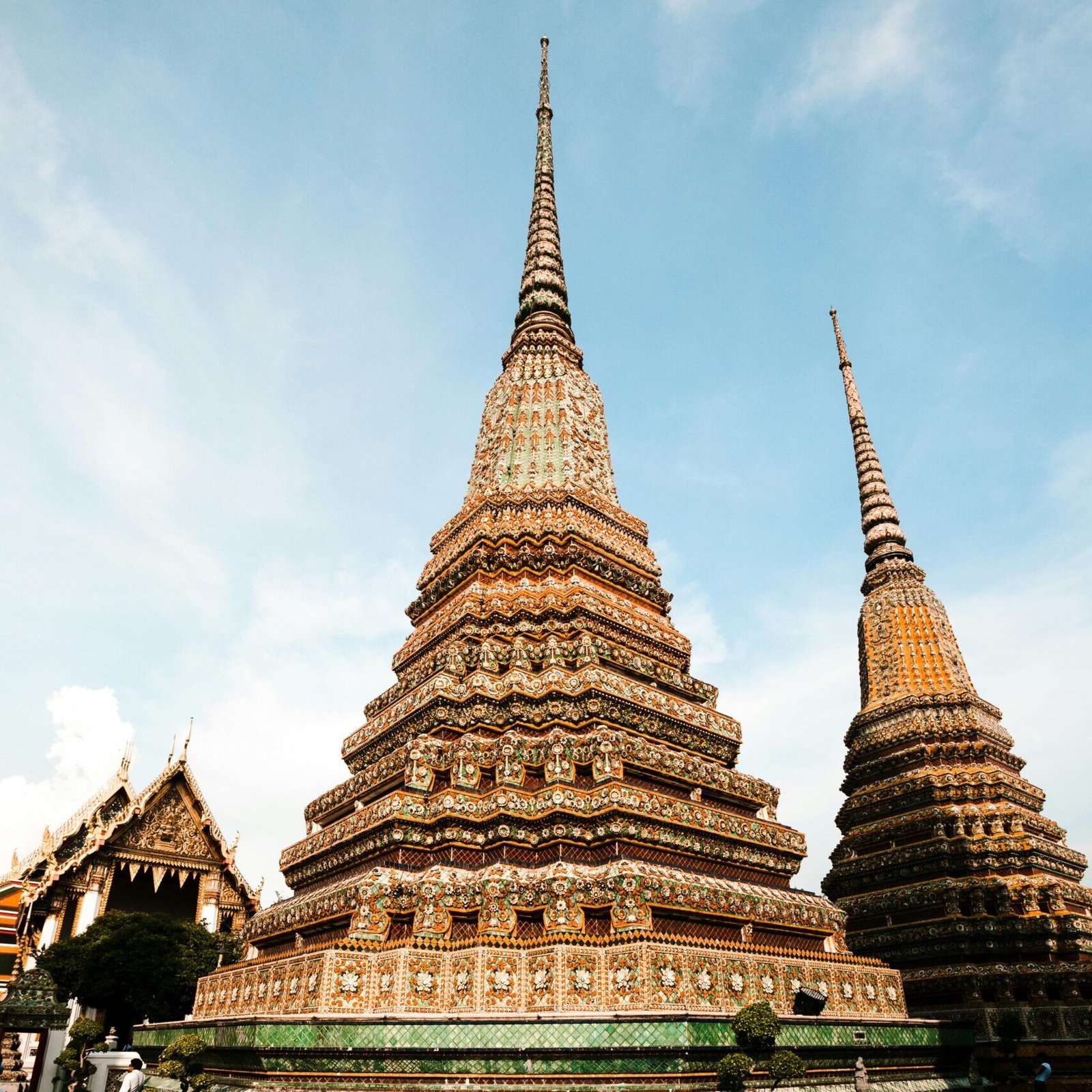 Stunning view of a richly adorned pagoda at Wat Pho temple complex in Bangkok, Thailand.